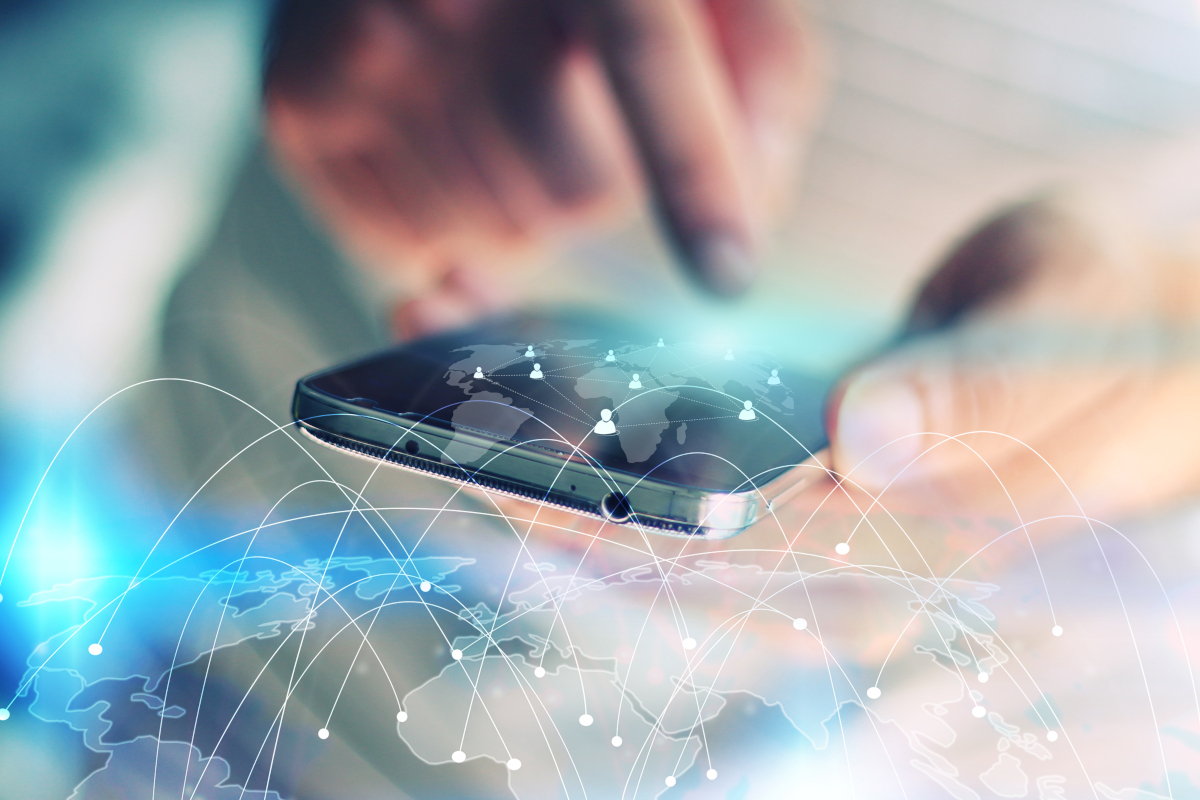 A hand operating a mobile phone